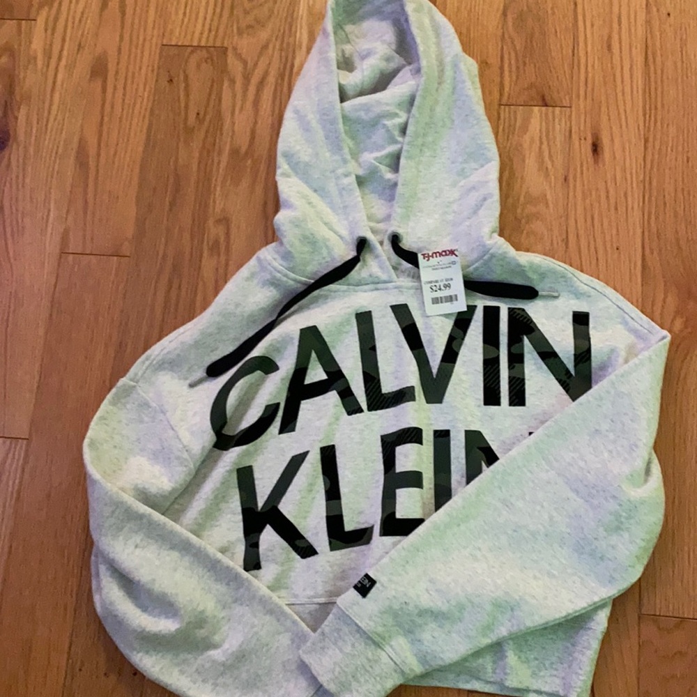 Calvin Klein cropped sweatshirt. The letters are Camo.